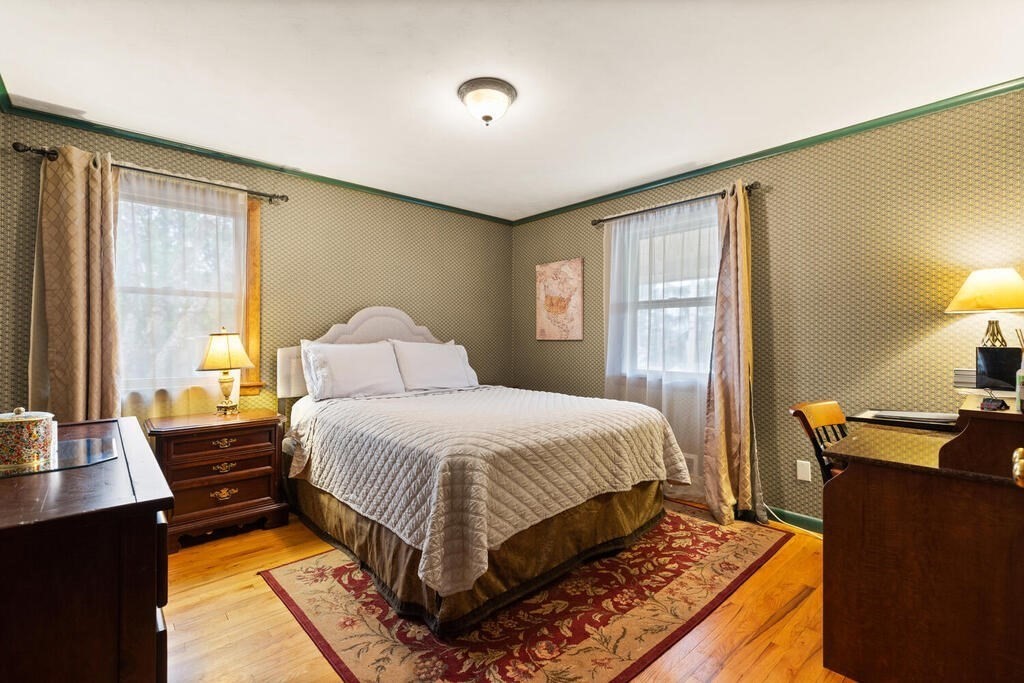 1 Meadowbrook Road Hudson, MA 01749 - Photo 25 of 36 a bedroom with a bed and wooden floor
