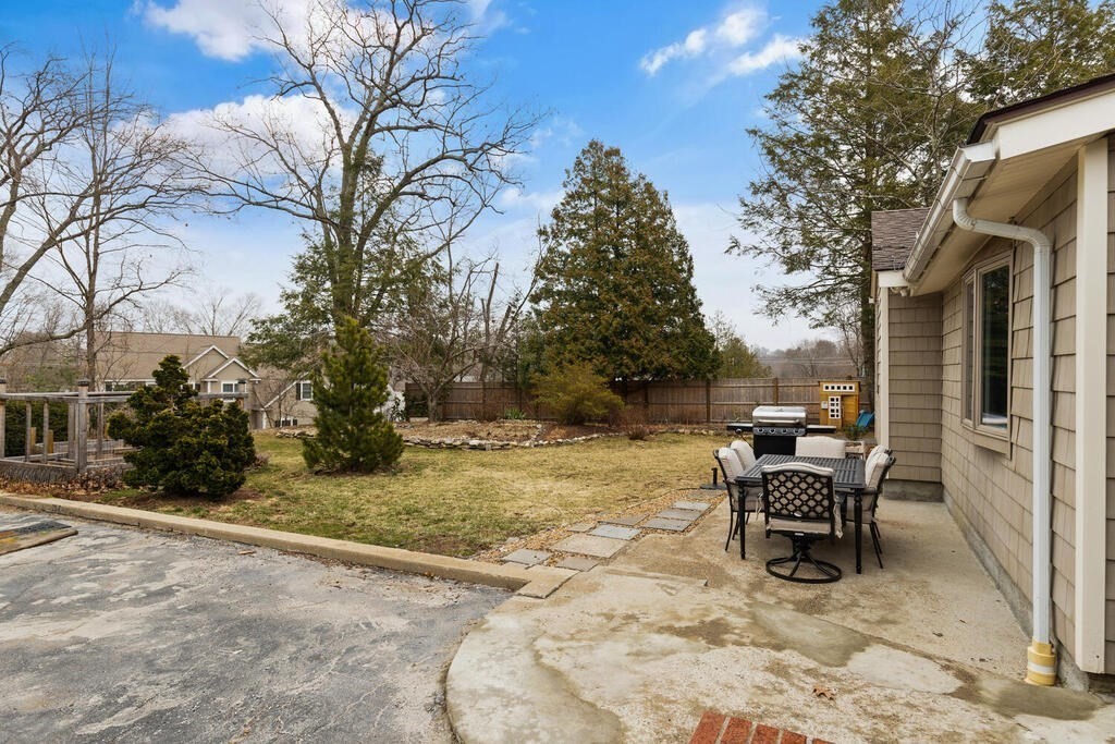 1 Meadowbrook Road Hudson, MA 01749 - Photo 28 of 36 a view of a yard with a table and chairs