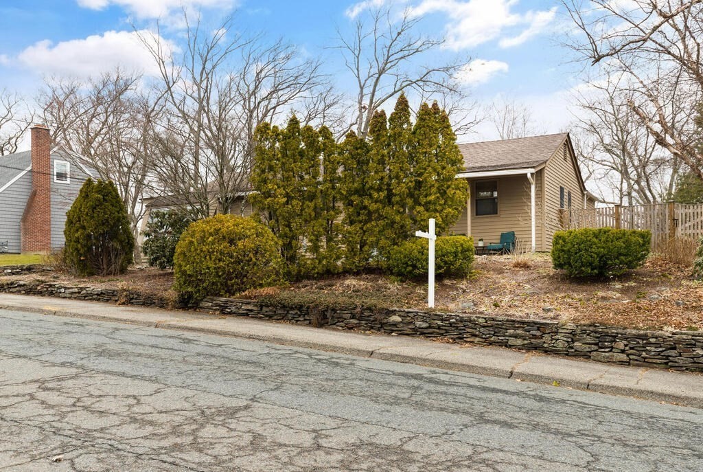 1 Meadowbrook Road Hudson, MA 01749 - Photo 3 of 36 a view of a house with a yard and large tree
