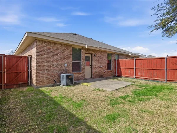 a view of a backyard of the house