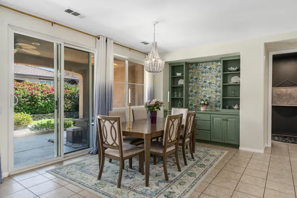 a dining room with furniture and window