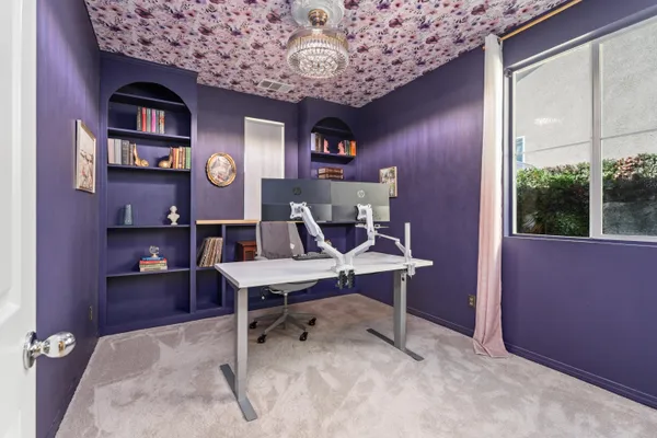 a view of a workspace with furniture