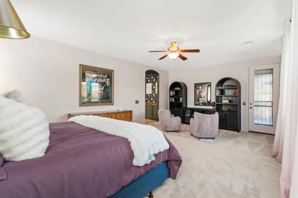 a bedroom with bed and window