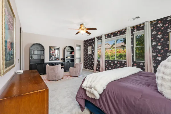 a bathroom with a granite countertop sink and a bathtub