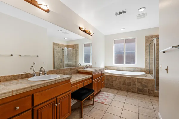 a bathroom with a tub and a shower