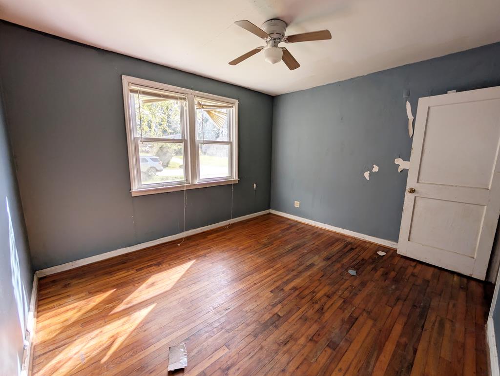4237 Fort Street Columbus, GA 31907 - Photo 12 of 16 a view of empty room with wooden floor and fan