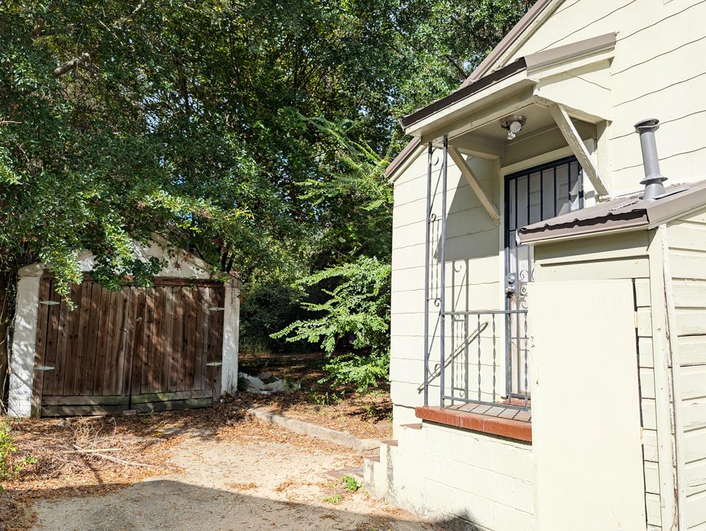 4237 Fort Street Columbus, GA 31907 - Photo 13 of 16 a view of a house with a door and wooden walls