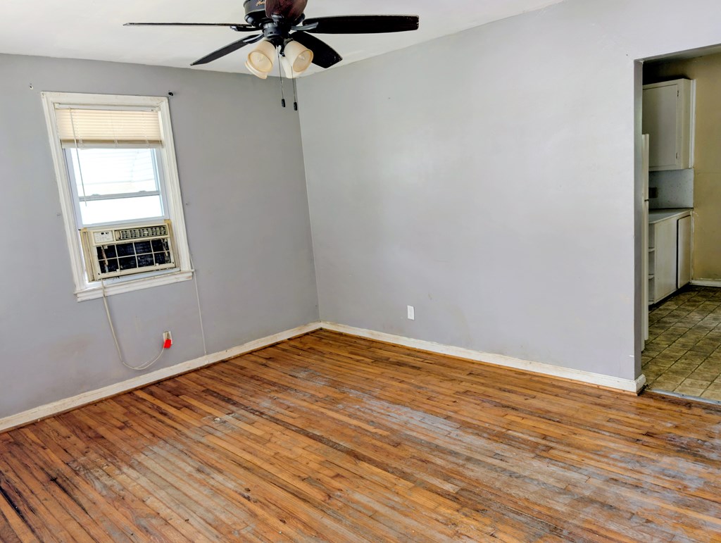 4237 Fort Street Columbus, GA 31907 - Photo 4 of 16 a view of empty room with wooden floor and fan