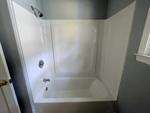 a close view of a bathtub in bathroom