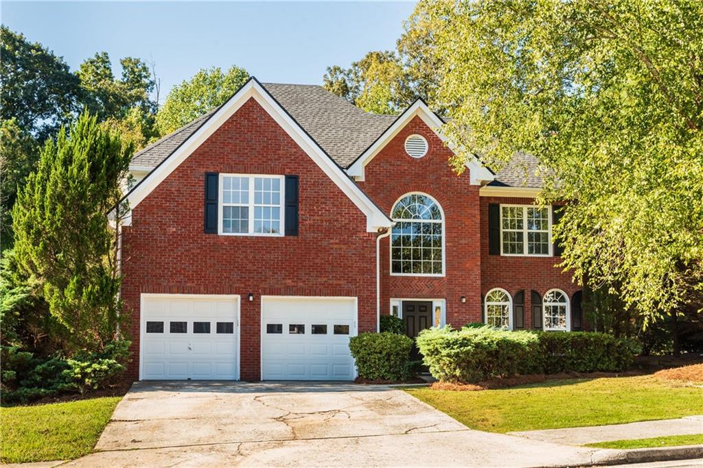 3778 Landau Lane Southwest Atlanta, GA 30331 - Photo 1 of 1 a view of a large brick building next to a yard