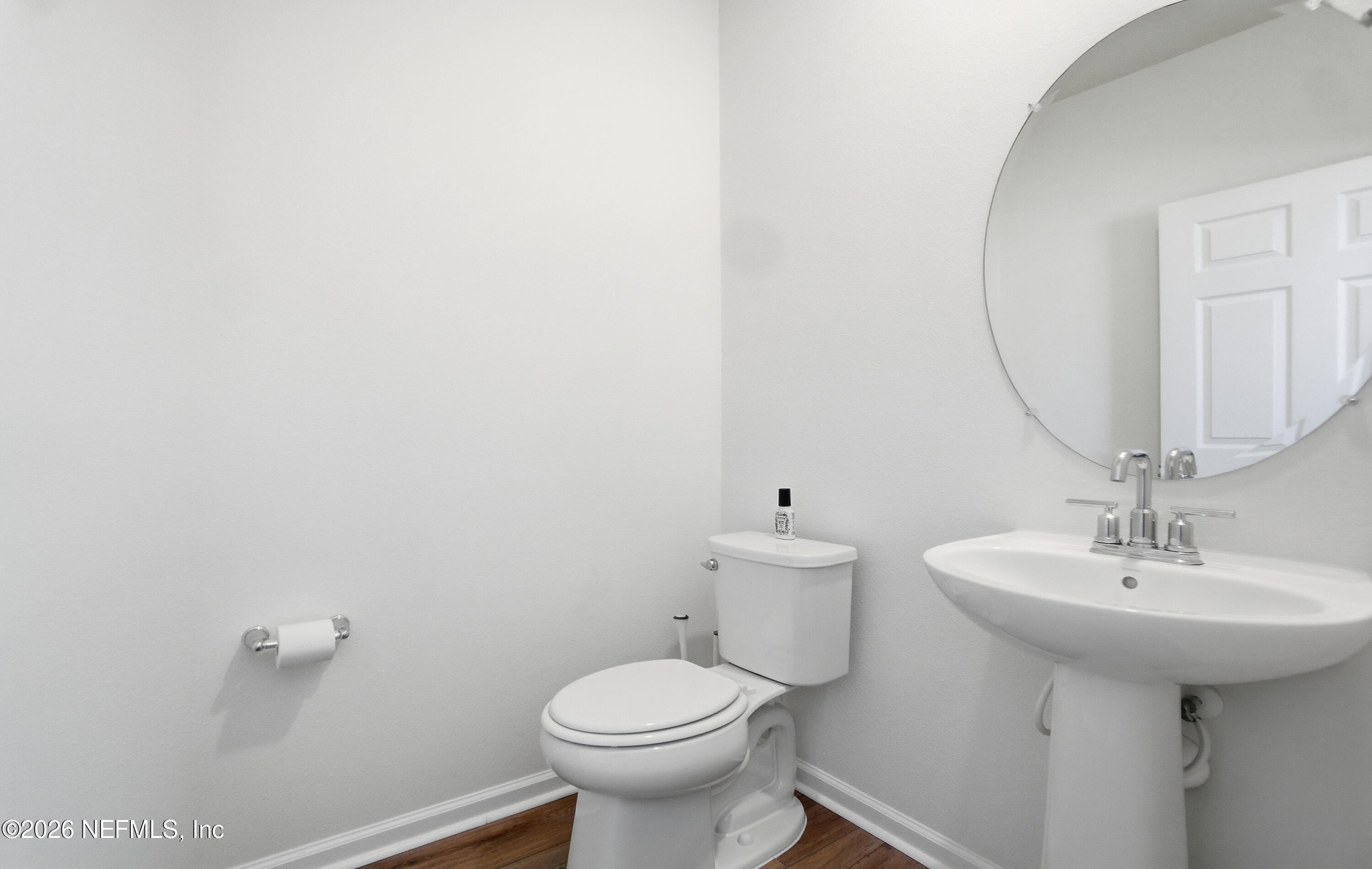 7662 Merchants Way Jacksonville, FL 32222 - Photo 13 of 32 a bathroom with a sink toilet and a mirror