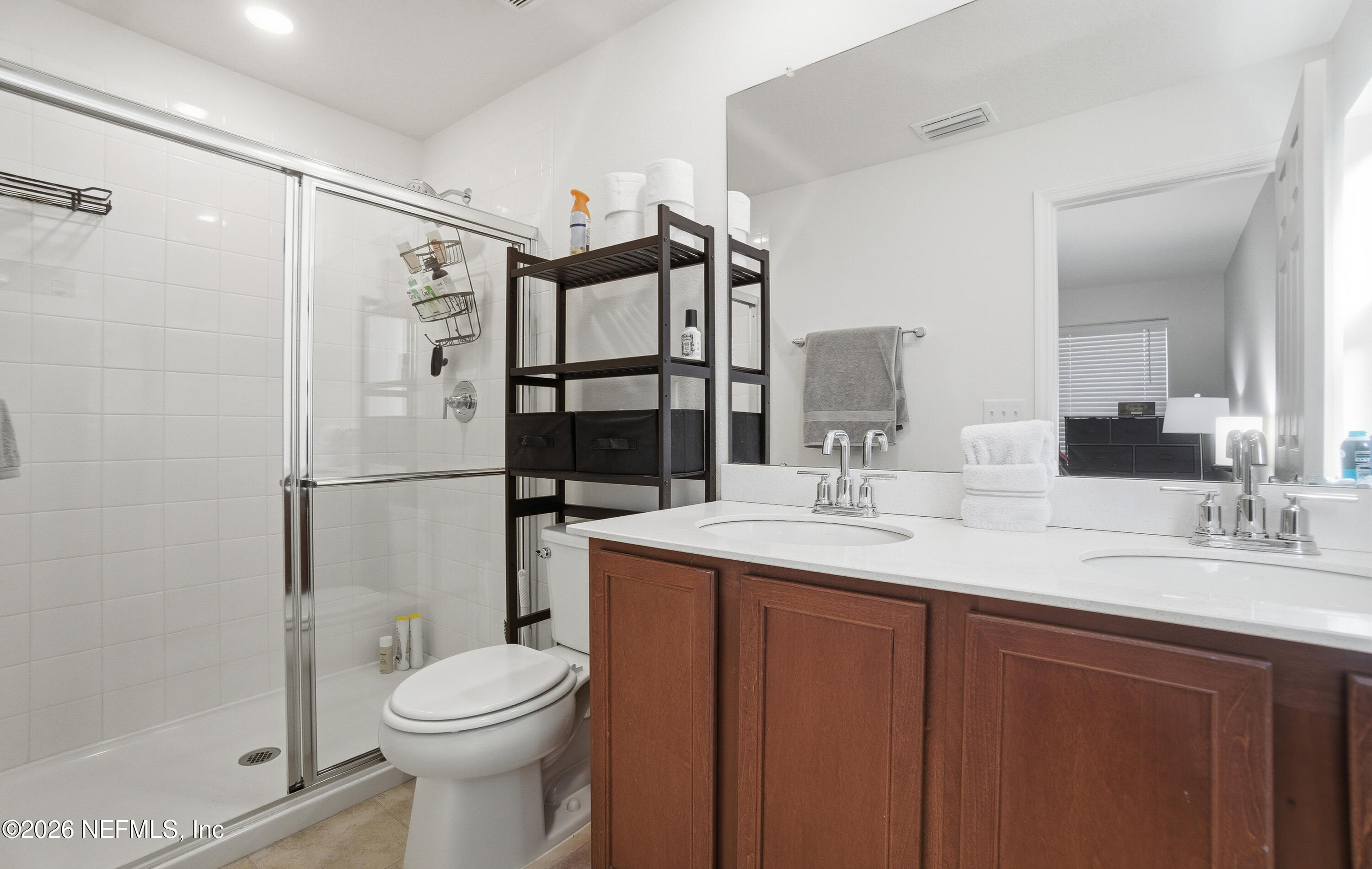 7662 Merchants Way Jacksonville, FL 32222 - Photo 16 of 32 a bathroom with a sink toilet and shower