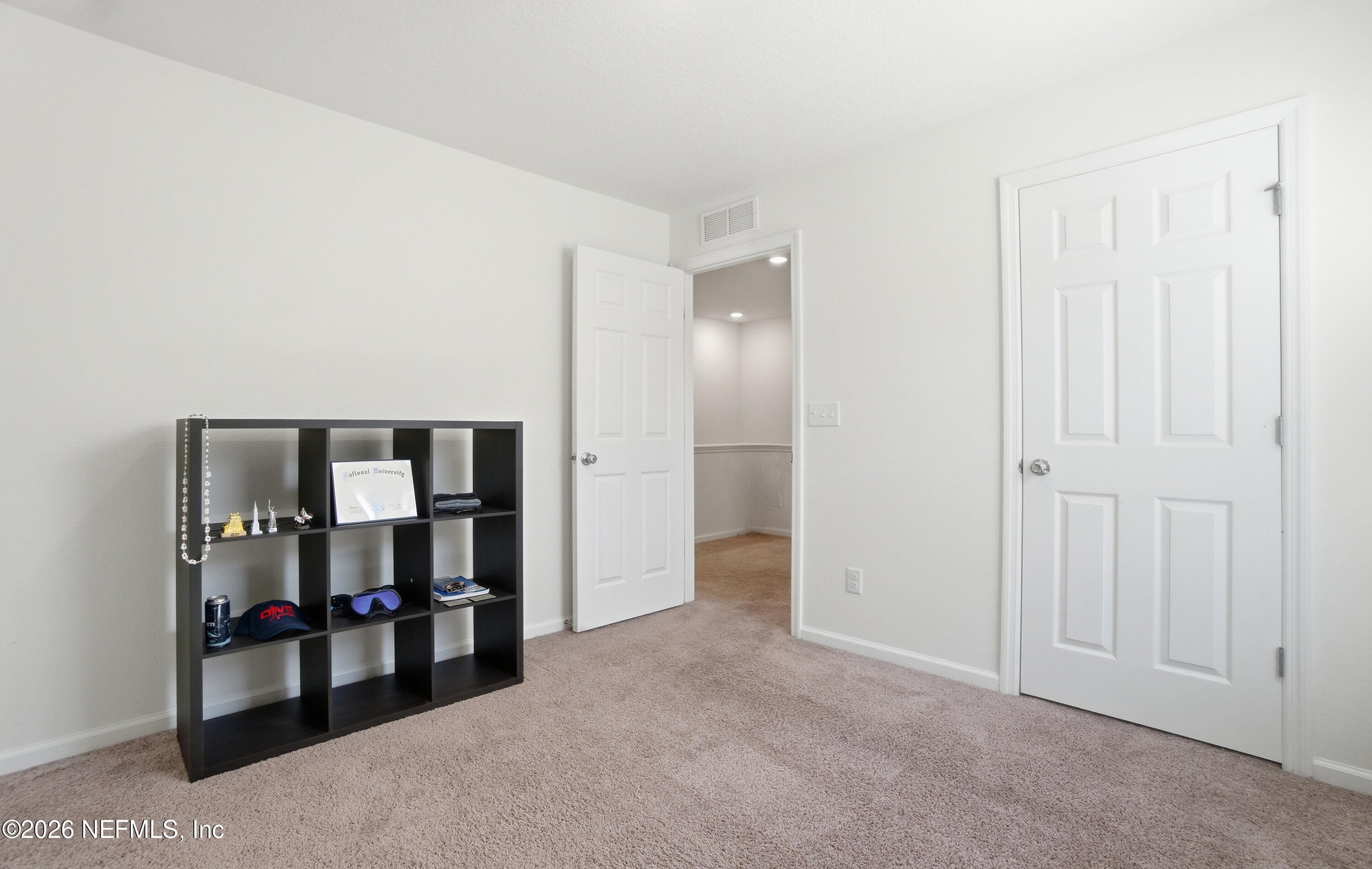 7662 Merchants Way Jacksonville, FL 32222 - Photo 18 of 32 a view of a room with walk in closet