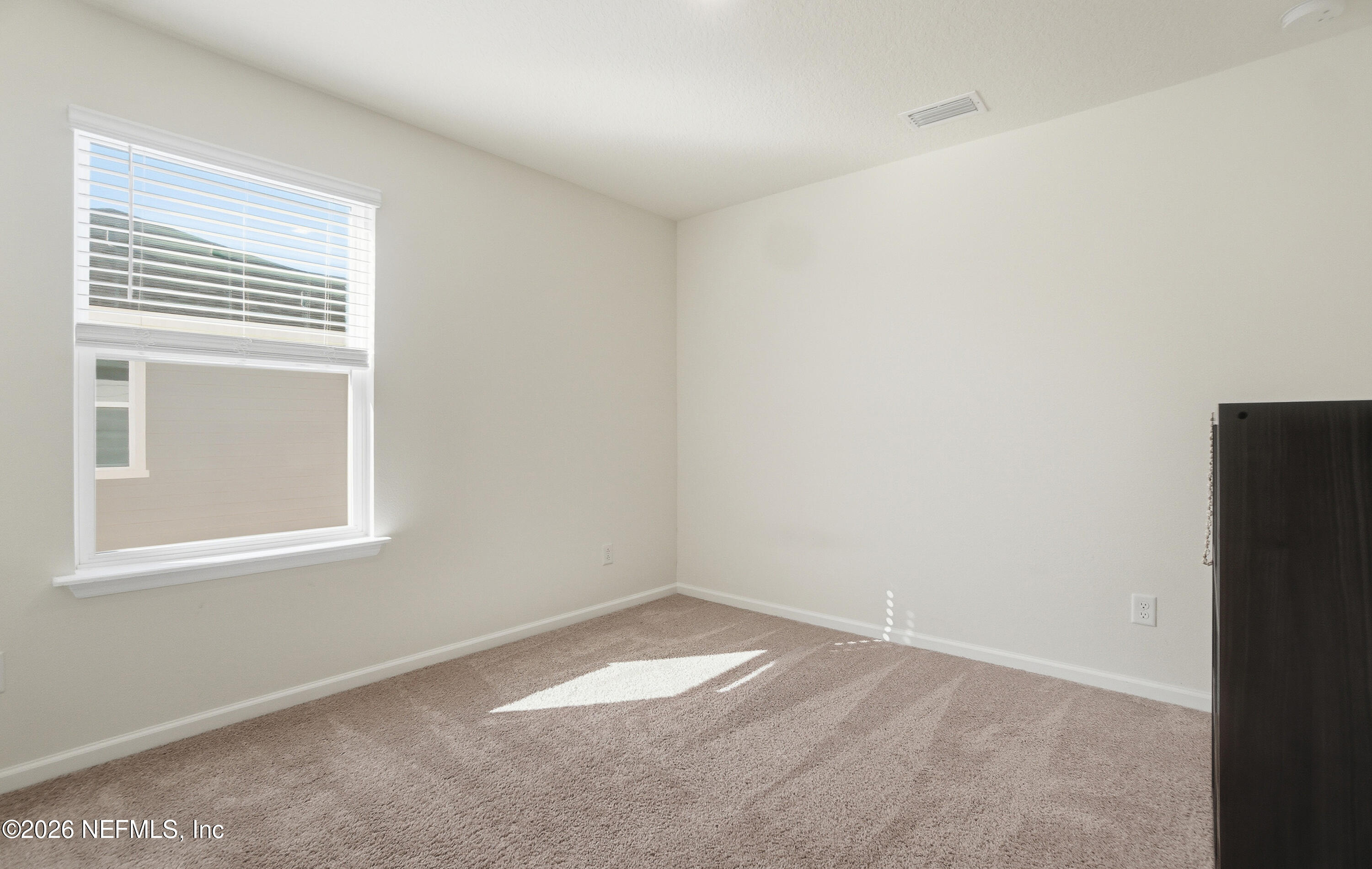 7662 Merchants Way Jacksonville, FL 32222 - Photo 19 of 32 an empty room with a window