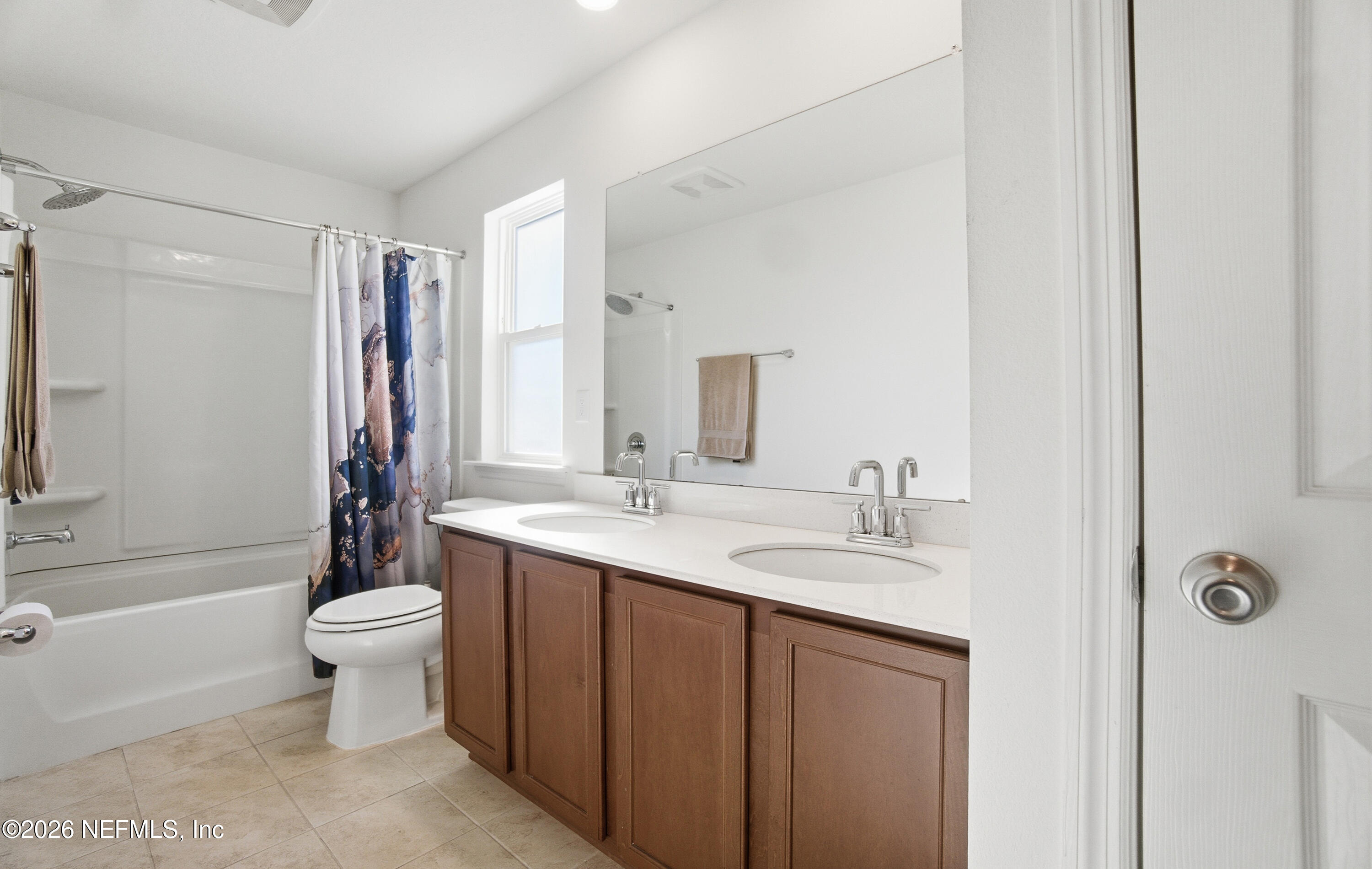 7662 Merchants Way Jacksonville, FL 32222 - Photo 20 of 32 a bathroom with a sink a toilet a mirror and shower