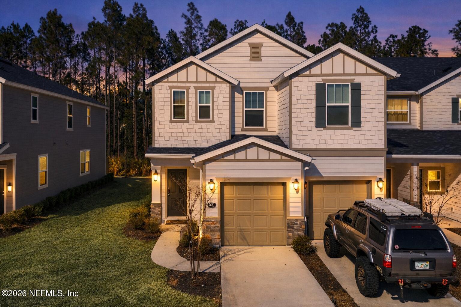 7662 Merchants Way Jacksonville, FL 32222 - Photo 26 of 32 a front view of a house with a yard