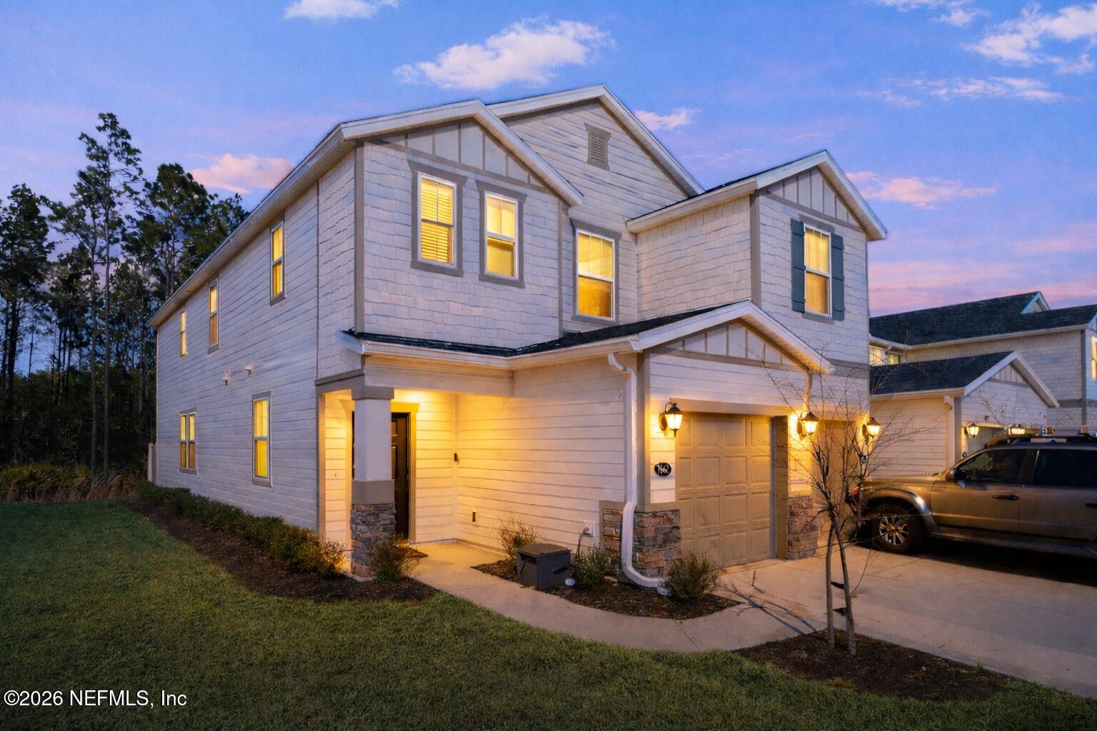 7662 Merchants Way Jacksonville, FL 32222 - Photo 27 of 32 a front view of a house with a yard
