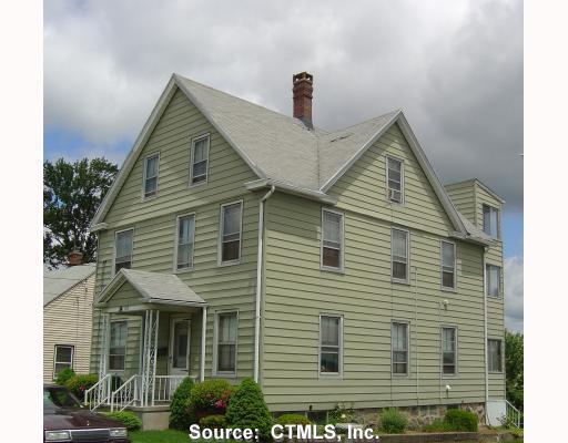 107 Addison Street Waterbury, CT 06708 - Photo 1 of 1 a view of a house with a yard and potted plants