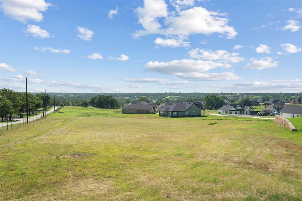 a view of a big yard with table & chairs