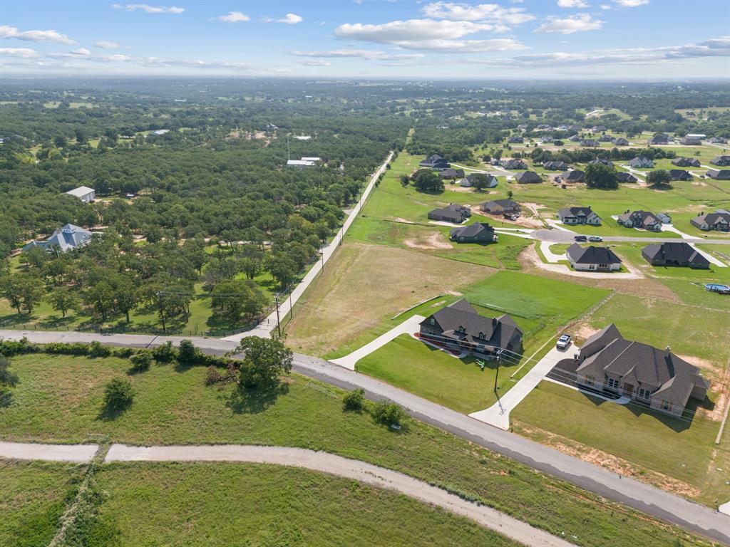 1052 North Agnes Road Springtown, TX 76082 - Photo 12 of 16 an aerial view of residential houses with outdoor space