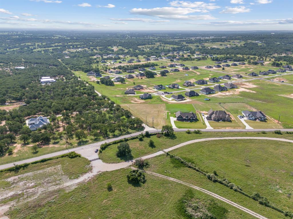 1052 North Agnes Road Springtown, TX 76082 - Photo 16 of 16 an aerial view of residential houses with outdoor space