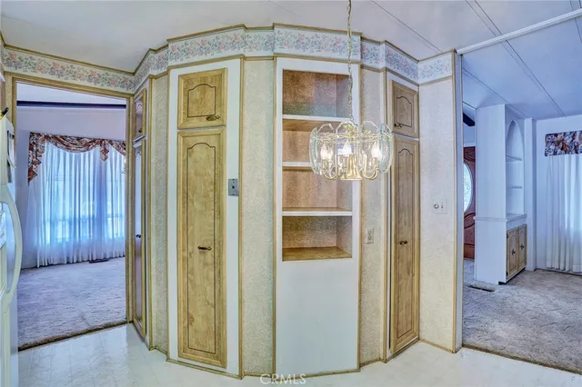 a kitchen that has a lot of cabinets in it