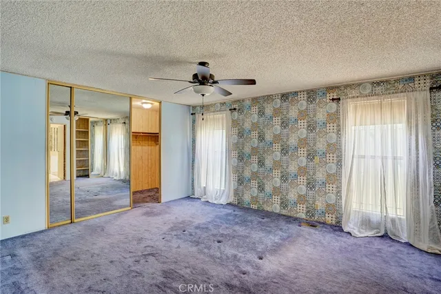 a view of a hallway with windows