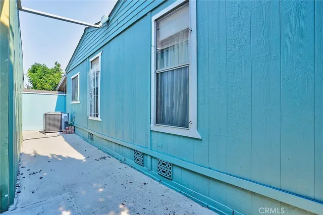 a view of building with cars parked in front of it