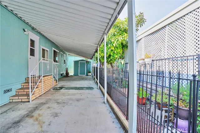 a view of a house with large garden and plants