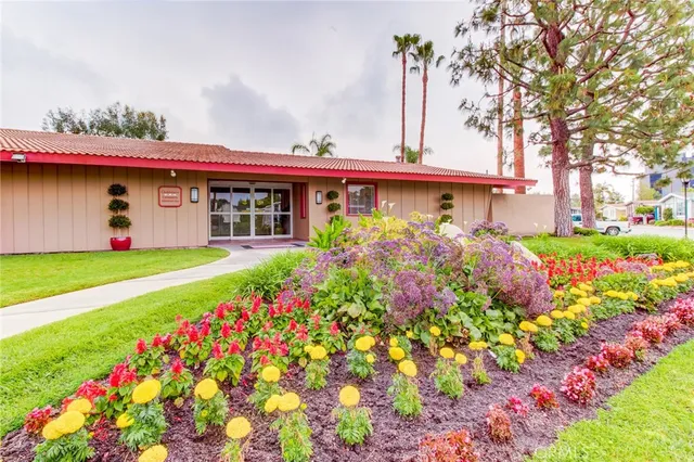 an aerial view of a house with swimming pool garden and patio
