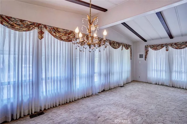 a view of an empty room with stairs