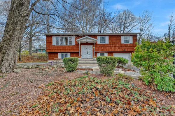 front view of a house with a yard