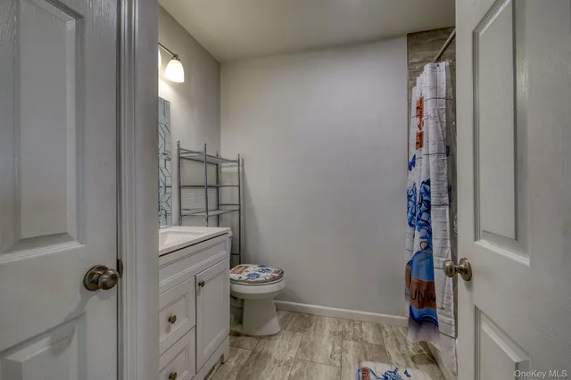 a room with water heater and wooden walls