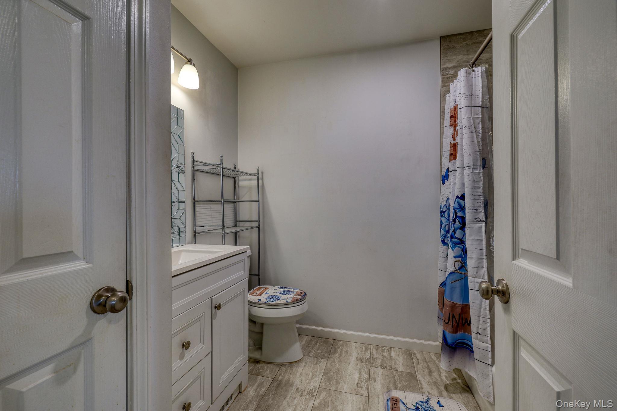 1 Townsend Street New Windsor, NY 12553 - Photo 16 of 36 a room with water heater and wooden walls