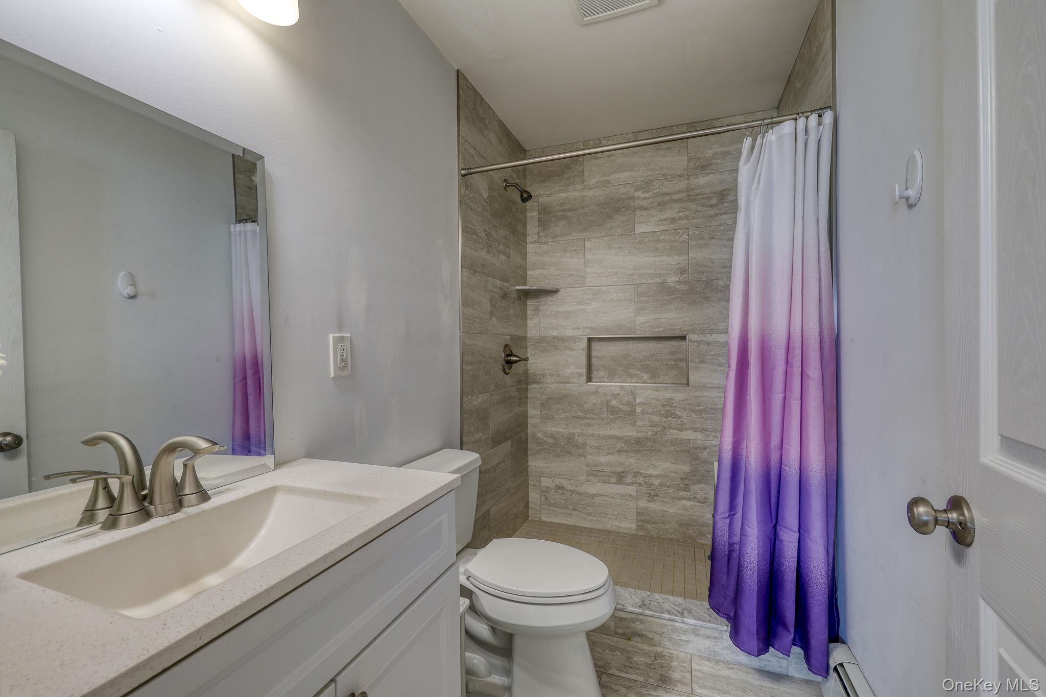 1 Townsend Street New Windsor, NY 12553 - Photo 20 of 36 a bathroom with a sink toilet and shower