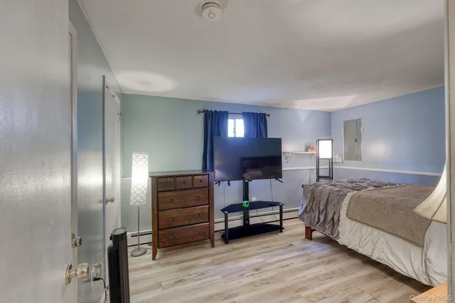 a lobby with furniture and chandelier