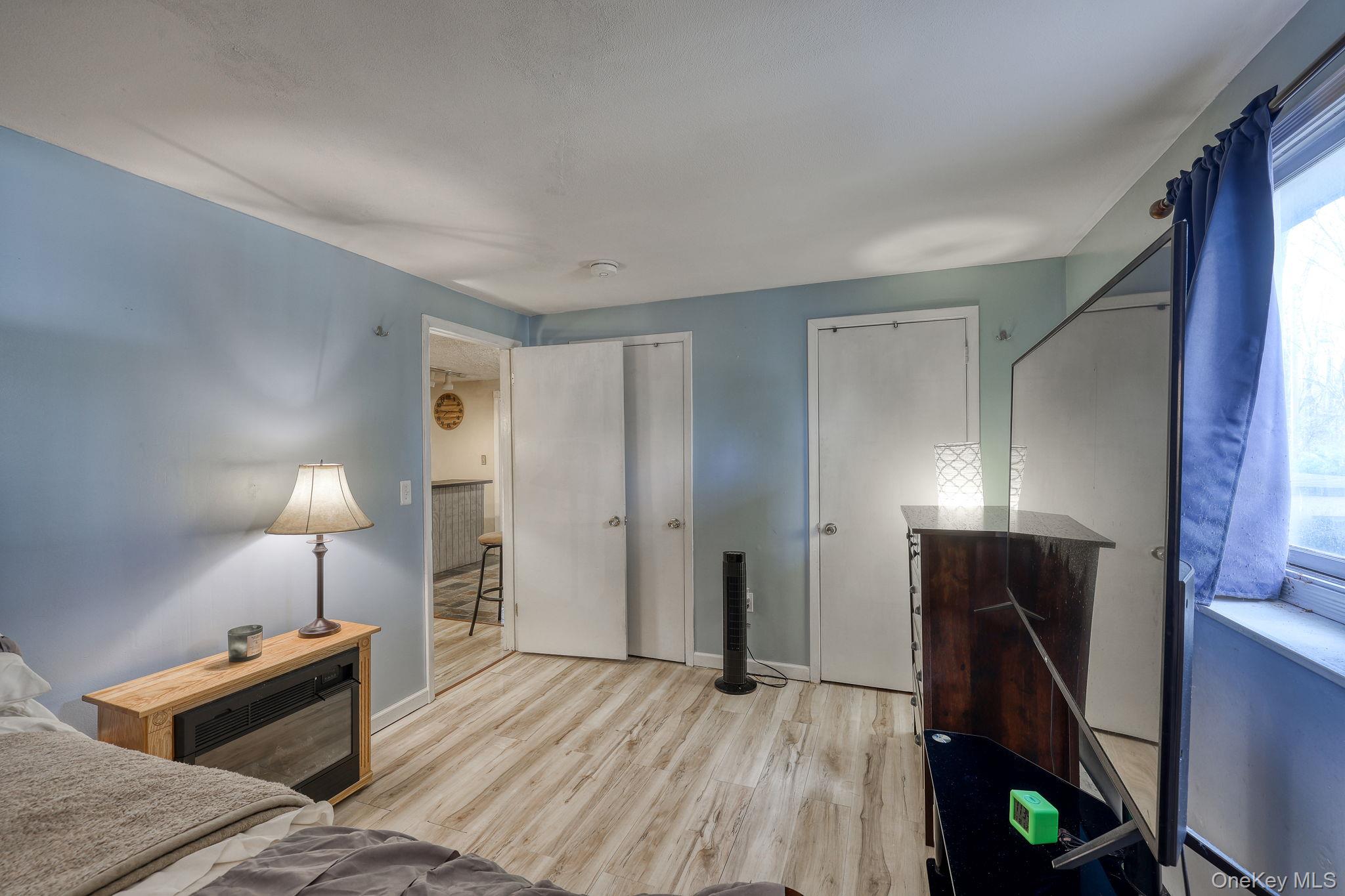 1 Townsend Street New Windsor, NY 12553 - Photo 28 of 36 a living room with furniture and a lamp