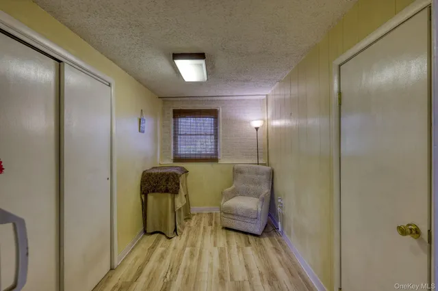 a living room with furniture and a lamp