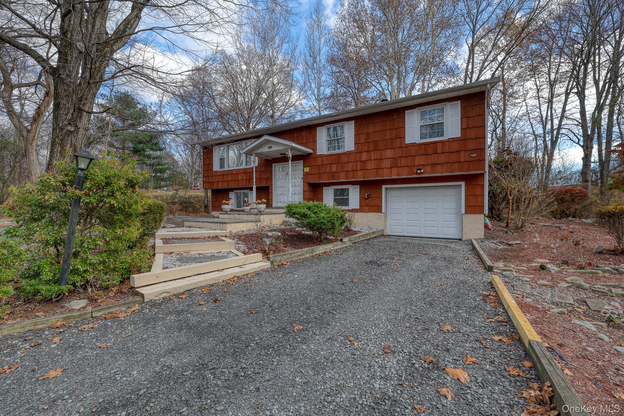 1 Townsend Street New Windsor, NY 12553 - Photo 3 of 36 a front view of a house with a yard and garage