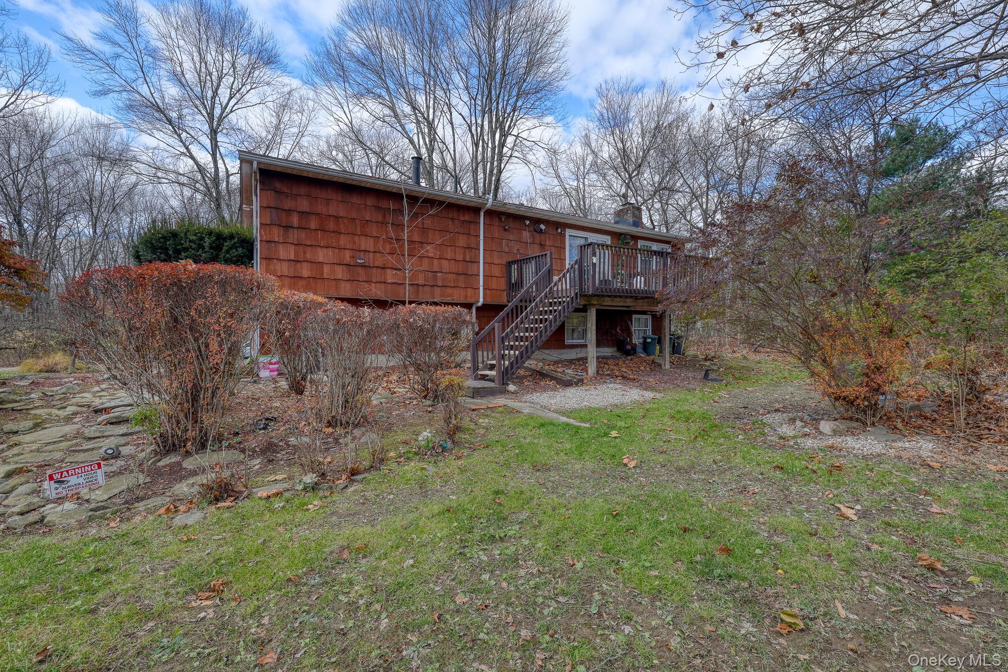1 Townsend Street New Windsor, NY 12553 - Photo 33 of 36 a view of a backyard that has a large tree and a small yard