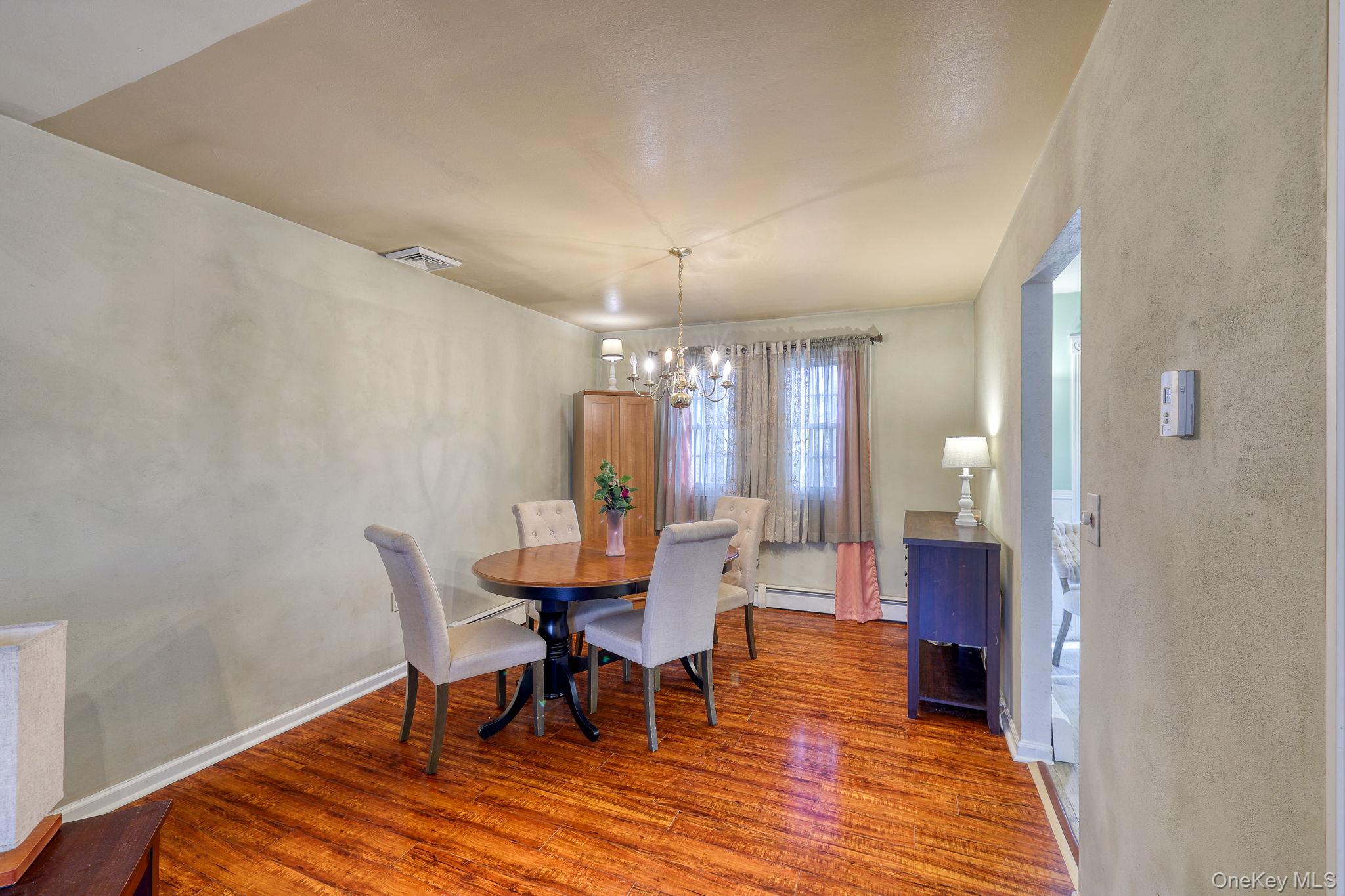 1 Townsend Street New Windsor, NY 12553 - Photo 10 of 36 a view of a dining room with furniture and wooden floor