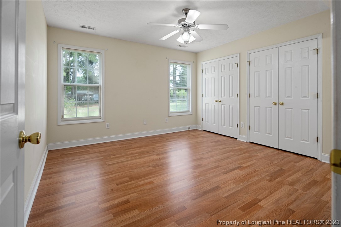 185 King Road Fayetteville, NC 28306 - Photo 11 of 24 a view of an empty room with a window and wooden floor