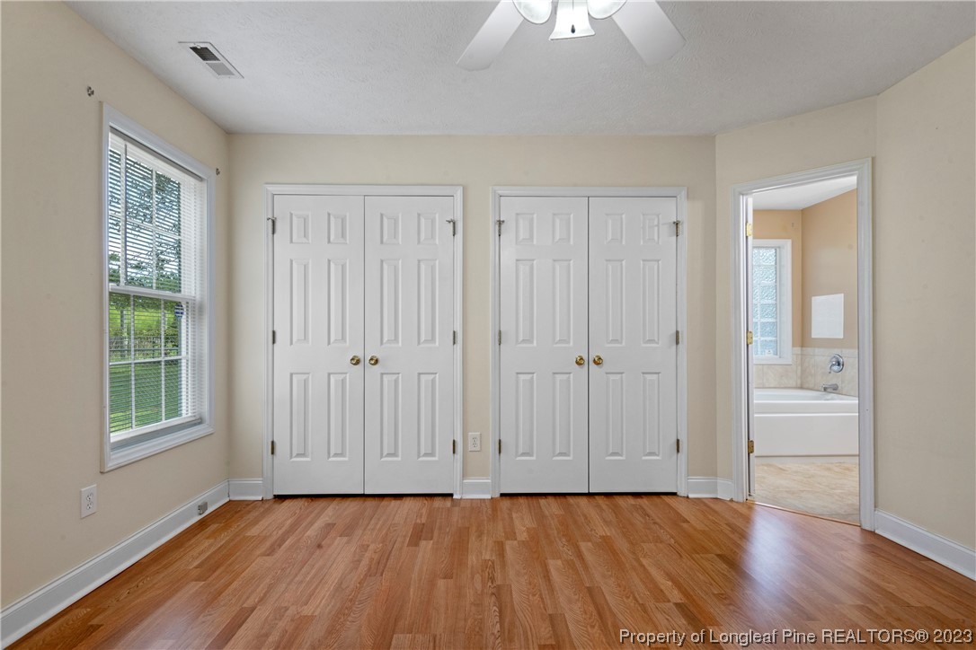 185 King Road Fayetteville, NC 28306 - Photo 12 of 24 a view of an empty room with window and wooden floor