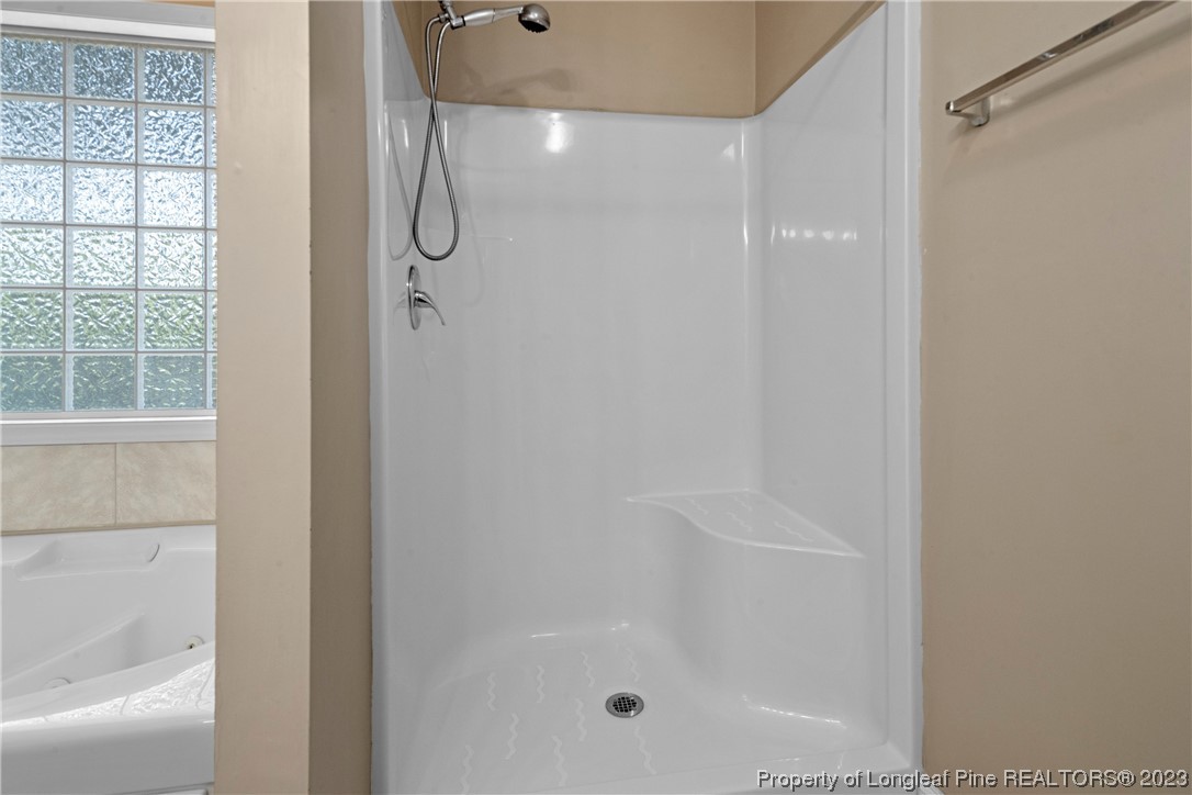 185 King Road Fayetteville, NC 28306 - Photo 15 of 24 a bathroom with a glass shower door