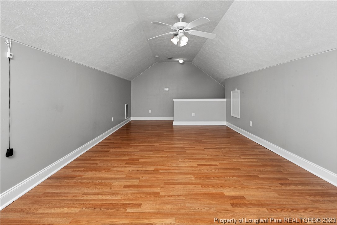 185 King Road Fayetteville, NC 28306 - Photo 20 of 24 wooden floor in an empty room with a window