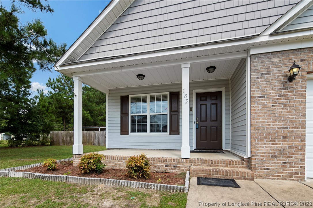 185 King Road Fayetteville, NC 28306 - Photo 2 of 24 a front view of a house with garden