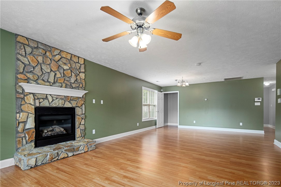 185 King Road Fayetteville, NC 28306 - Photo 3 of 24 a view of an empty room with a fireplace and a window