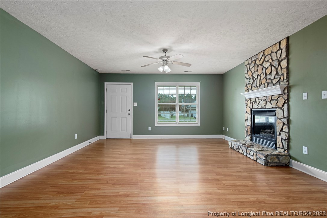 185 King Road Fayetteville, NC 28306 - Photo 4 of 24 a view of an empty room with a window and a fireplace