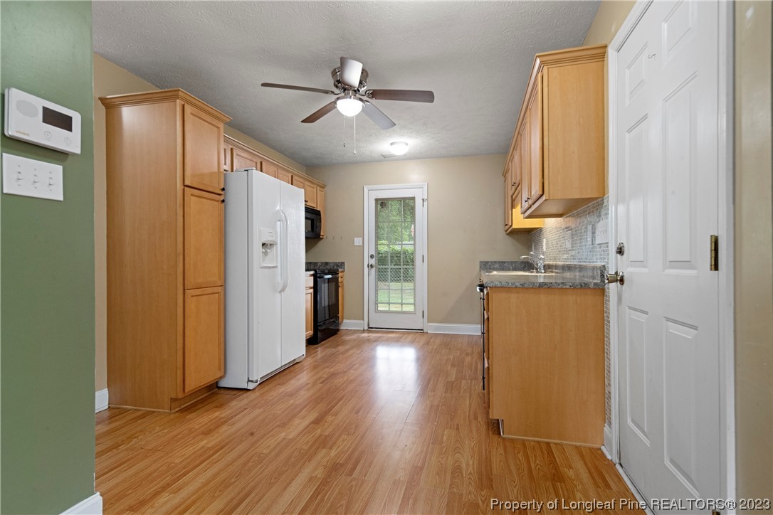 185 King Road Fayetteville, NC 28306 - Photo 6 of 24 a view of empty room with wooden floor and fan