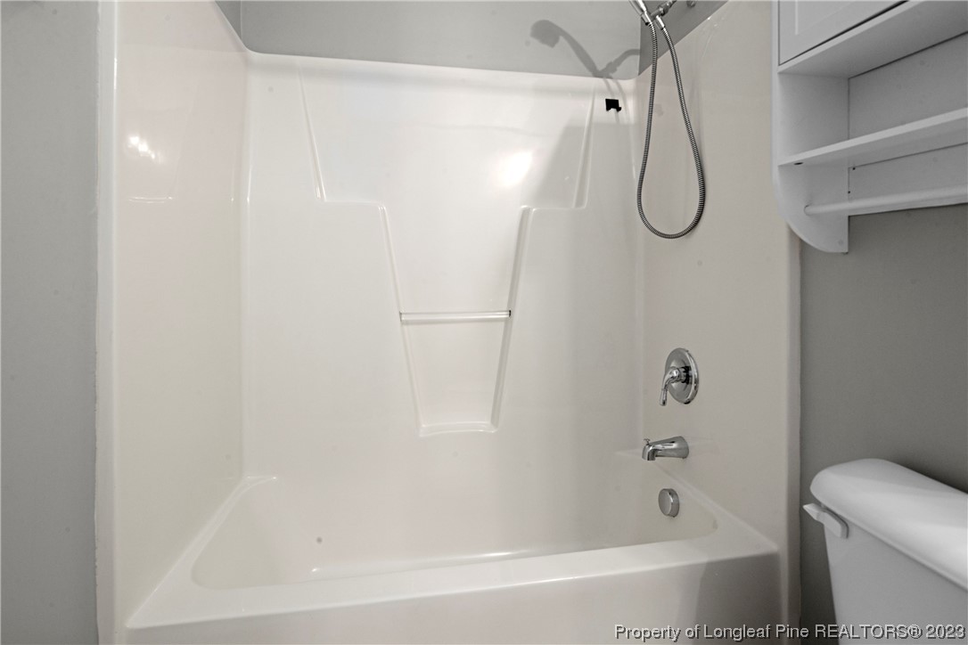 185 King Road Fayetteville, NC 28306 - Photo 10 of 24 a bathroom with a bath tub with a shower